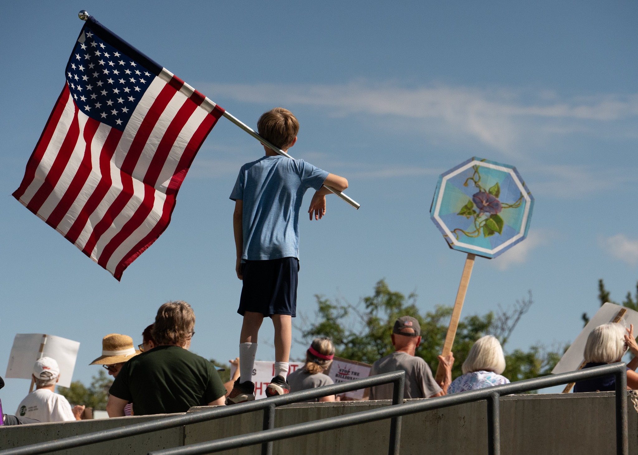 Child waving flag; photo courtesy of Thomas Graves